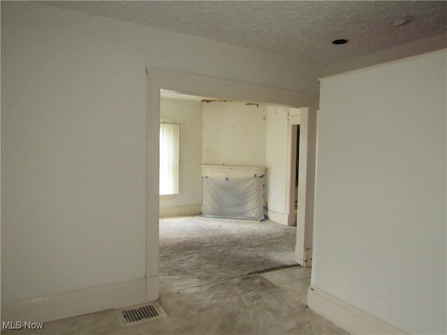 1831 Knowles St, East Cleveland, OH 44112 - hall featuring visible vents, a textured ceiling, and baseboards