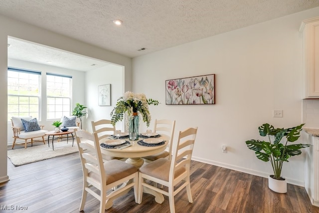 835-2 Dipper Ln, Aurora, OH 44202 - dining space featuring wood finished floors and a textured ceiling