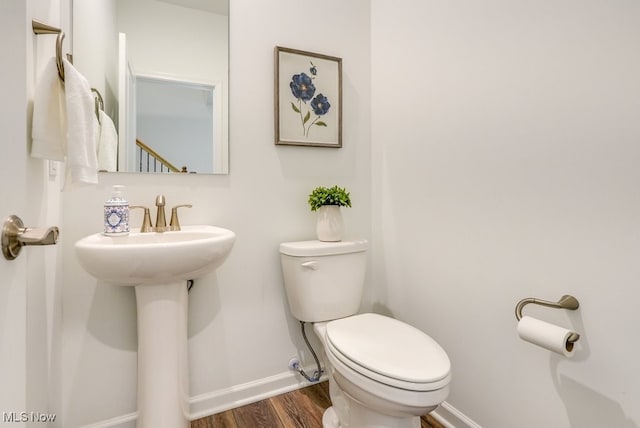 835-2 Dipper Ln, Aurora, OH 44202 - half bathroom featuring baseboards and wood finished floors