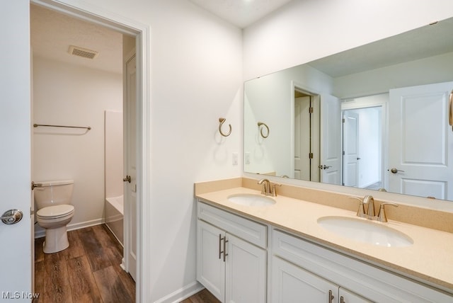 835-2 Dipper Ln, Aurora, OH 44202 - bathroom with double vanity and wood finished floors
