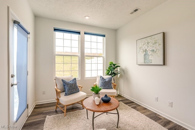 835-2 Dipper Ln, Aurora, OH 44202 - living area featuring dark wood-style flooring and a textured ceiling