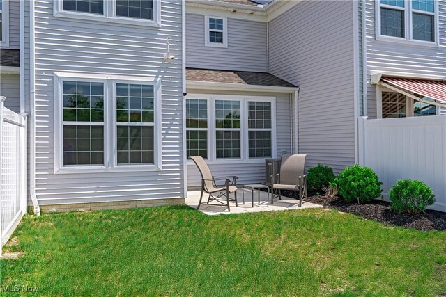 835-2 Dipper Ln, Aurora, OH 44202 - rear view of property featuring a patio area and roof with shingles