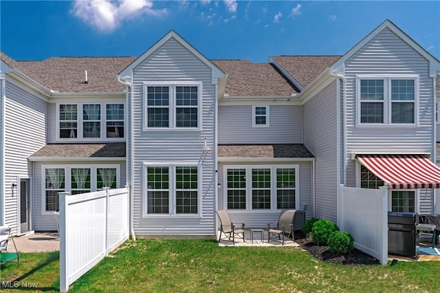 835-2 Dipper Ln, Aurora, OH 44202 - rear view of house featuring a patio area and a shingled roof