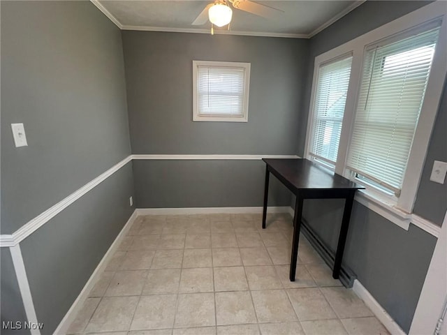 office with crown molding, light tile patterned flooring, baseboards, and a ceiling fan