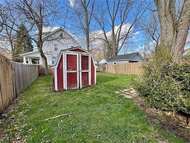 view of shed with a fenced backyard