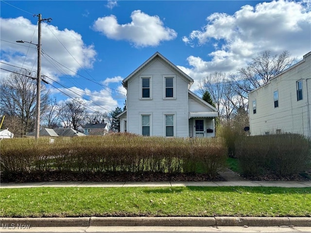 view of front of property with a front lawn