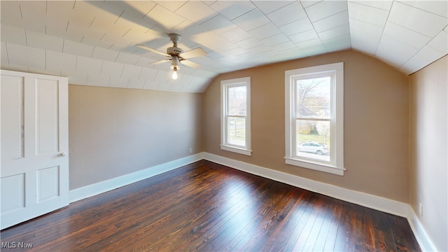 additional living space featuring ceiling fan, baseboards, dark wood-style floors, and lofted ceiling