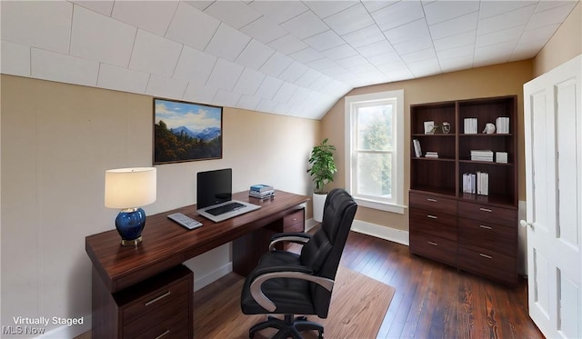 office area featuring baseboards, vaulted ceiling, and dark wood finished floors