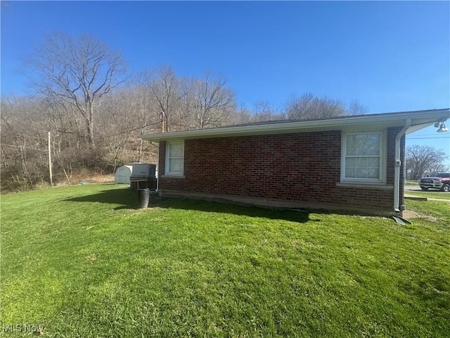 36577 State Route 7, Sardis, OH 43946 - view of side of property with brick siding and a lawn