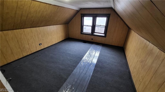 12614 Forest Ave, Cleveland, OH 44120 - additional living space featuring wooden walls, vaulted ceiling, and carpet floors