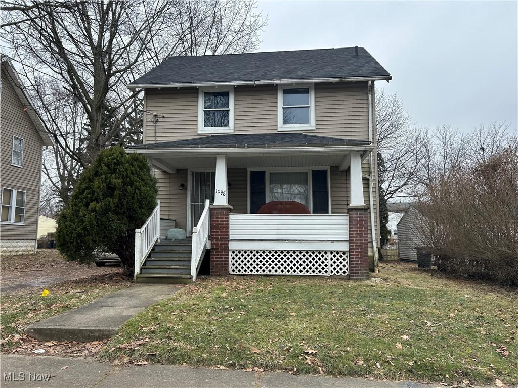 1098 Wyley Ave, Akron, OH 44306 - view of front of house featuring a porch, a shingled roof, and a front yard