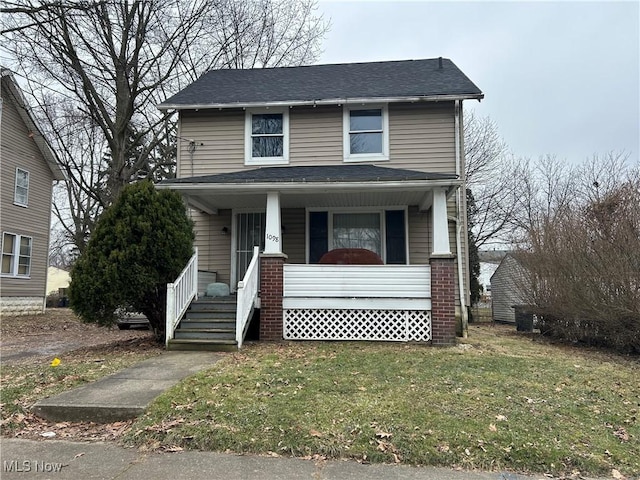1098 Wyley Ave, Akron, OH 44306 - view of front of house featuring a porch, a shingled roof, and a front yard