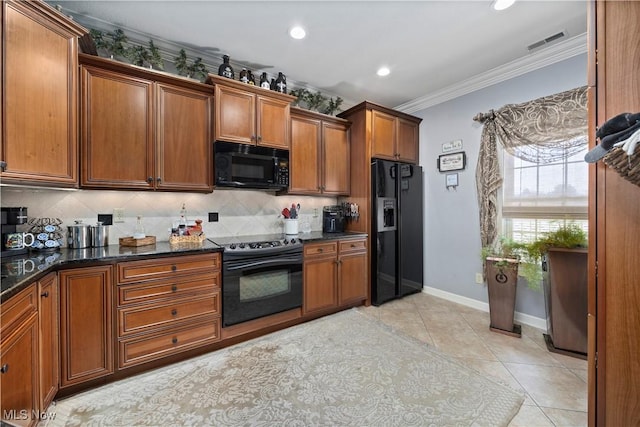 kitchen with brown cabinetry, black appliances, decorative backsplash, ornamental molding, and visible vents