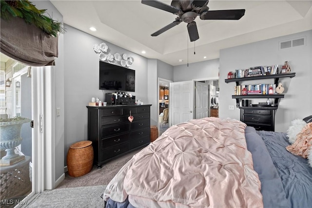 bedroom featuring ceiling fan, carpet floors, a raised ceiling, visible vents, and recessed lighting