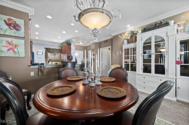 carpeted dining room with visible vents, recessed lighting, and ornamental molding