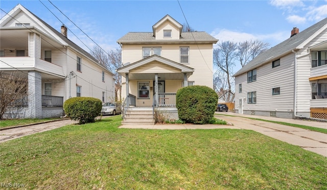 14117 Sylvia Ave, Cleveland, OH 44110 - traditional style home with a porch and a front lawn