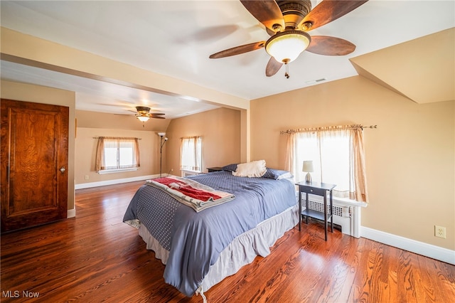 bedroom with baseboards, wood finished floors, and ceiling fan