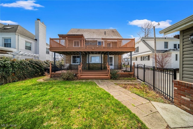 rear view of house with a wooden deck