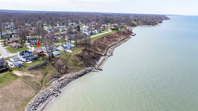 aerial overview of property's location featuring a nearby body of water and nearby suburban area