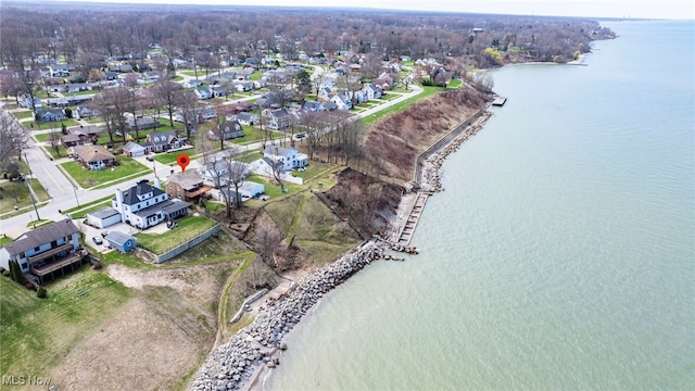 aerial overview of property's location featuring a nearby body of water and nearby suburban area