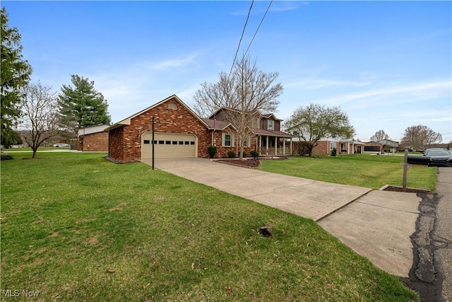 101 Keyser St, Marietta, OH 45750 - view of front of home with an attached garage, driveway, a front yard, and brick siding