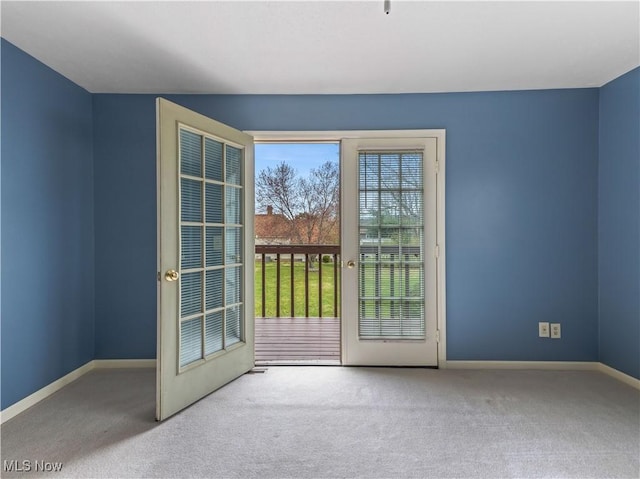 101 Keyser St, Marietta, OH 45750 - doorway to outside featuring baseboards and carpet