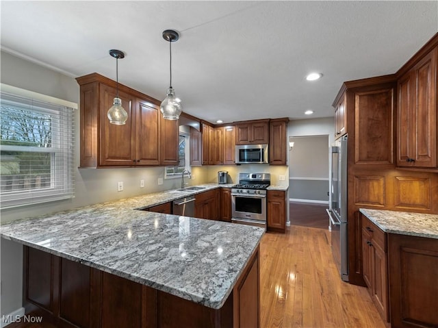 101 Keyser St, Marietta, OH 45750 - kitchen with a peninsula, appliances with stainless steel finishes, a sink, and a wealth of natural light