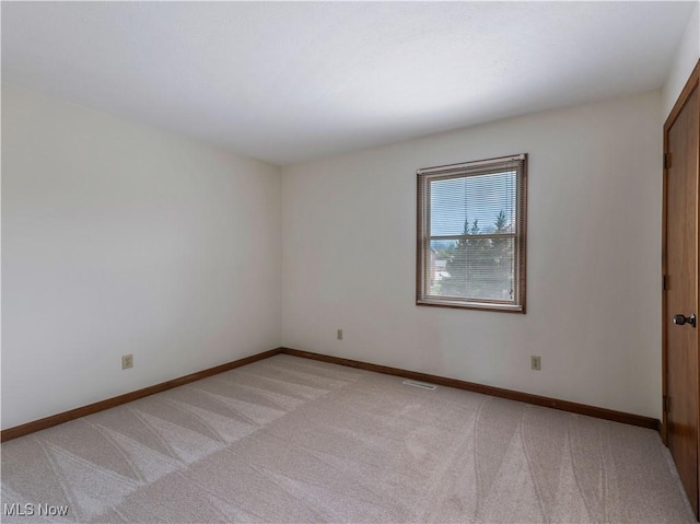 101 Keyser St, Marietta, OH 45750 - spare room featuring visible vents, baseboards, and light colored carpet