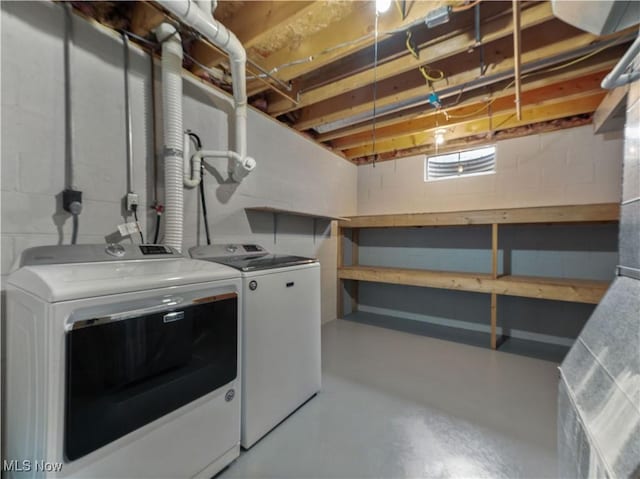 101 Keyser St, Marietta, OH 45750 - laundry area with laundry area, washing machine and clothes dryer, and concrete block wall