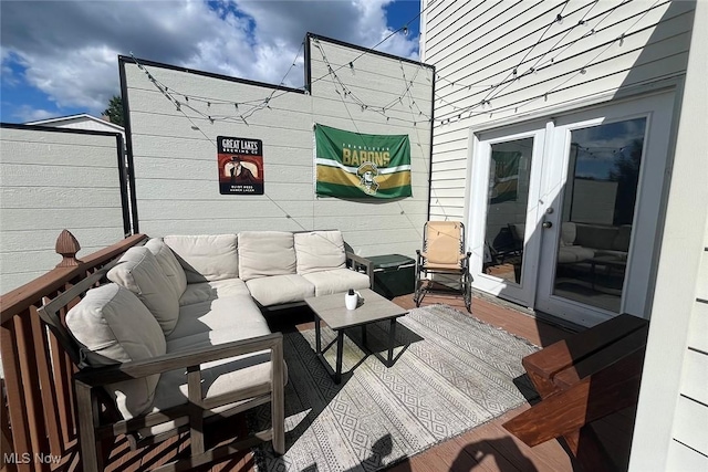 wooden deck featuring outdoor lounge area