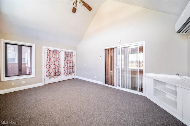 2457 Sheffield Rd, Jefferson, OH 44047 - spare room featuring a wall mounted air conditioner, ceiling fan, plenty of natural light, carpet, and high vaulted ceiling