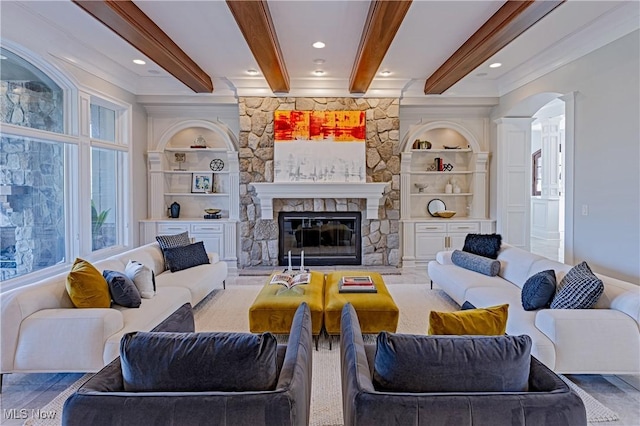 3377 E Galloway Dr, Richfield, OH 44286 - living area with beamed ceiling, a fireplace, and built in shelves