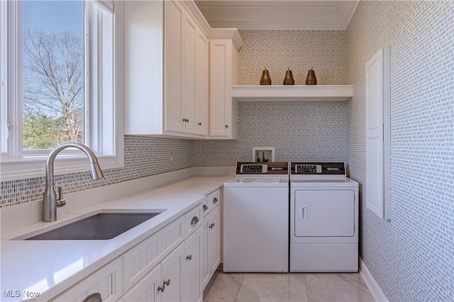 3377 E Galloway Dr, Richfield, OH 44286 - laundry area featuring crown molding, light tile patterned floors, independent washer and dryer, a sink, and cabinet space