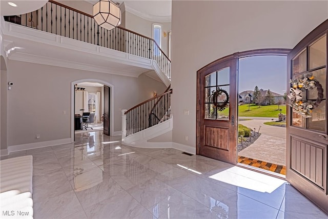 3377 E Galloway Dr, Richfield, OH 44286 - entryway featuring baseboards, stairway, arched walkways, and marble finish floor