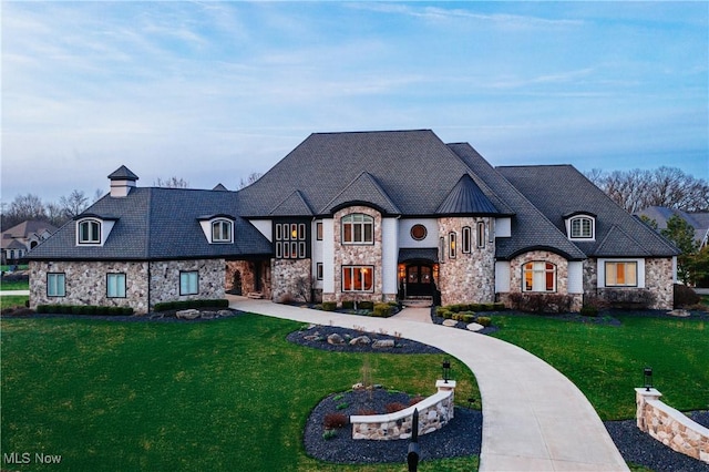 3377 E Galloway Dr, Richfield, OH 44286 - french country home featuring a front yard and stone siding