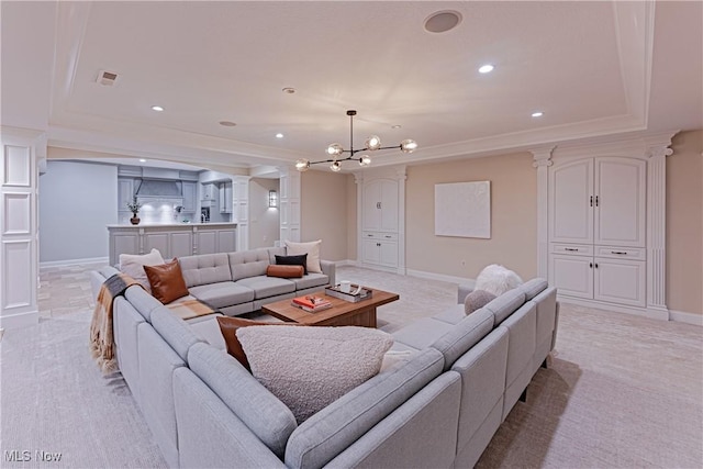 3377 E Galloway Dr, Richfield, OH 44286 - living room featuring an inviting chandelier, decorative columns, visible vents, recessed lighting, and baseboards