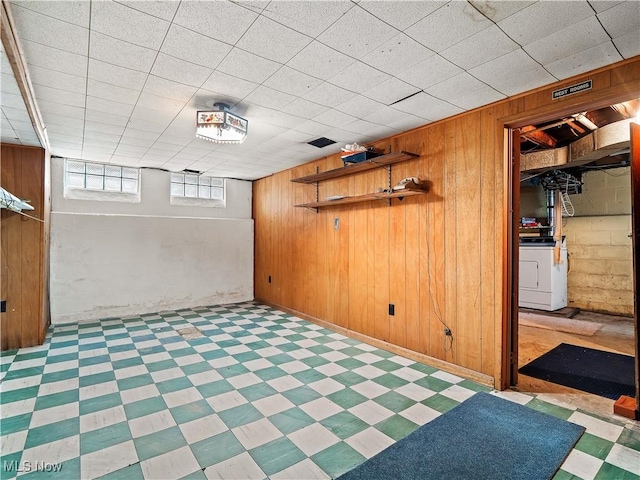 13908 Highlandview Ave, Cleveland, OH 44135 - below grade area featuring wooden walls, tile patterned floors, and washer / clothes dryer