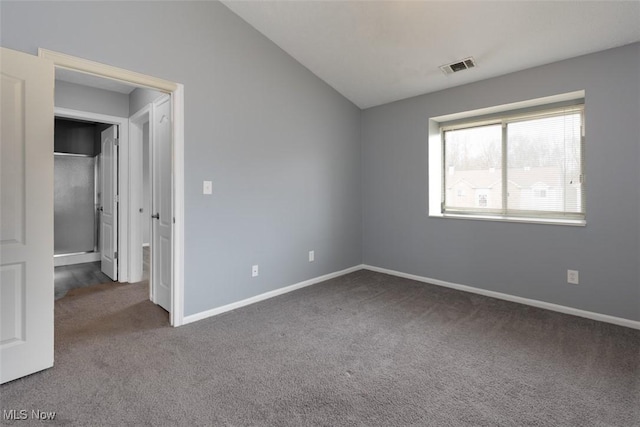 362 Village Pointe Dr, Akron, OH 44313 - unfurnished bedroom featuring baseboards, lofted ceiling, visible vents, and carpet floors
