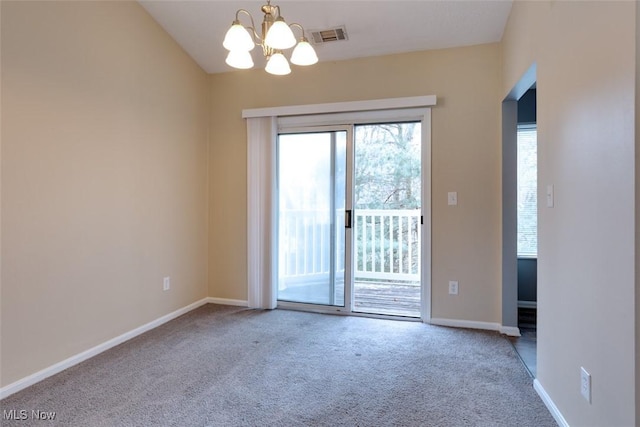 362 Village Pointe Dr, Akron, OH 44313 - empty room featuring a notable chandelier, visible vents, baseboards, and carpet floors