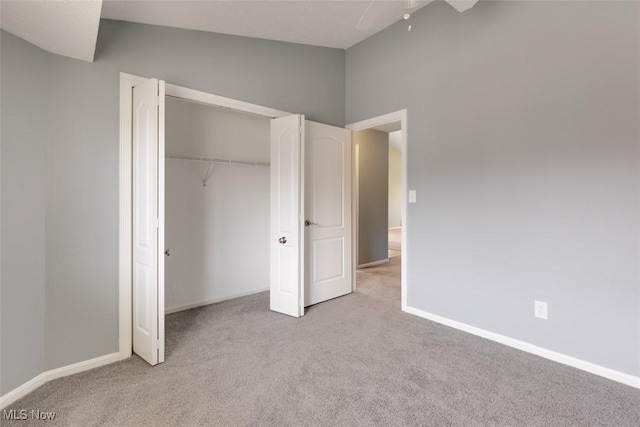 362 Village Pointe Dr, Akron, OH 44313 - unfurnished bedroom with a closet, baseboards, a ceiling fan, and carpet flooring