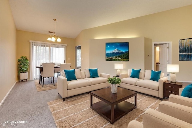 362 Village Pointe Dr, Akron, OH 44313 - living area with baseboards, a chandelier, carpet floors, visible vents, and high vaulted ceiling