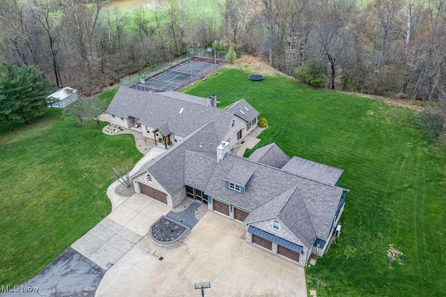 drone / aerial view with a view of trees