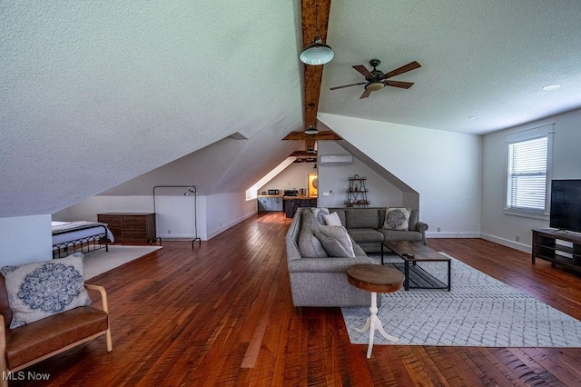 living room with lofted ceiling with beams, a textured ceiling, a ceiling fan, hardwood / wood-style floors, and baseboards