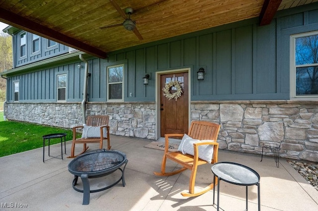 view of patio / terrace featuring a fire pit and ceiling fan