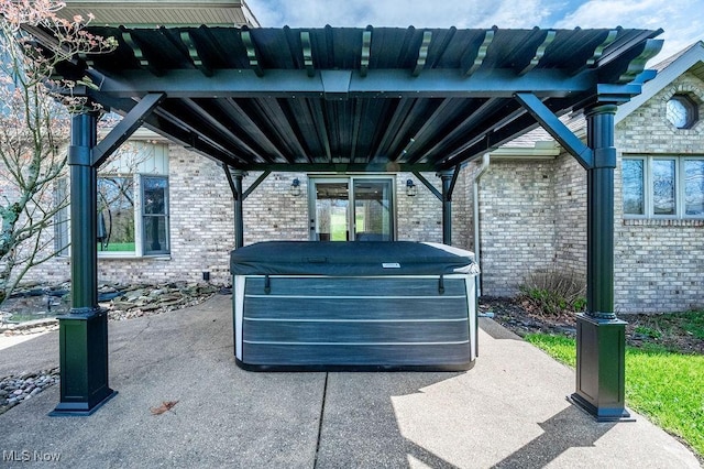 view of patio with a hot tub