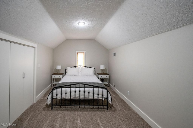 bedroom featuring baseboards, carpet, and vaulted ceiling