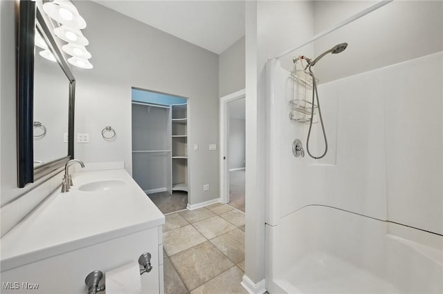 2484 Eaton Rd, University Heights, OH 44118 - bathroom with a shower, vanity, and tile patterned floors