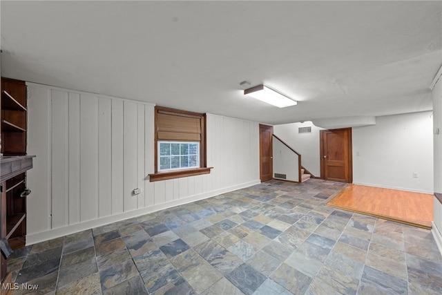 2484 Eaton Rd, University Heights, OH 44118 - basement with stone finish floors, baseboards, and stairs