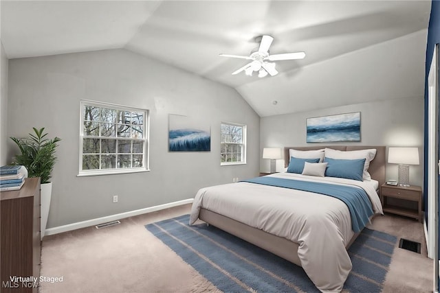2484 Eaton Rd, University Heights, OH 44118 - carpeted bedroom with vaulted ceiling, baseboards, and a ceiling fan