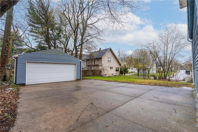 detached garage featuring a residential view